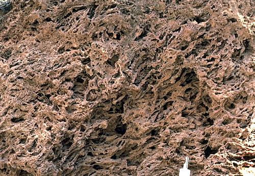 Close-up of waterfall-associated travertine deposits.